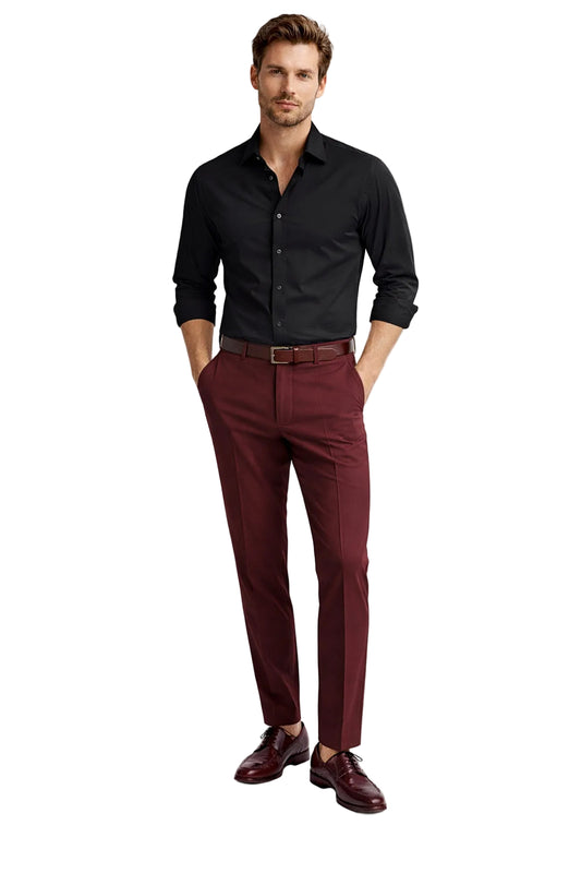 Man wearing a black shirt and maroon pants on a white background