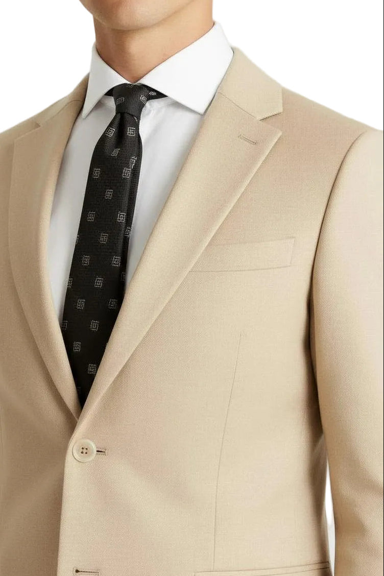 Beige suit jacket with a white shirt and black patterned tie on a light gray background